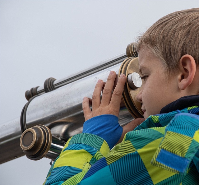 data-collection-640x595 A child looking through a telescope