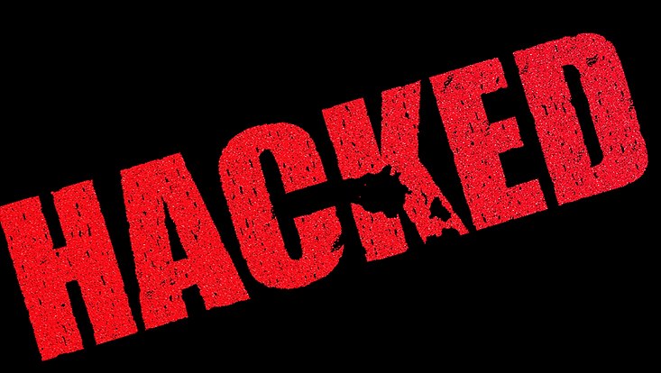 Rotes Wort HACKED auf schwarzem Grund.