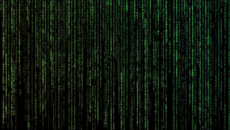 Von oben nach unten wandernde grüne Buchstaben auf schwarzem Grund