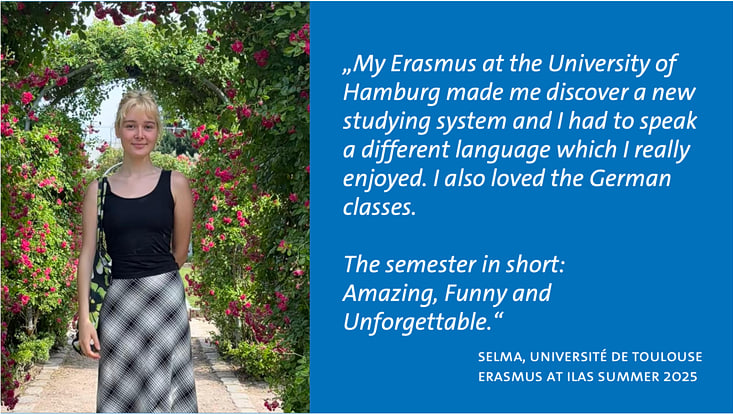 selma-erasmus-teaser-1 Studentin Selma steht sommerlich gekleidet in einem Blumengarten