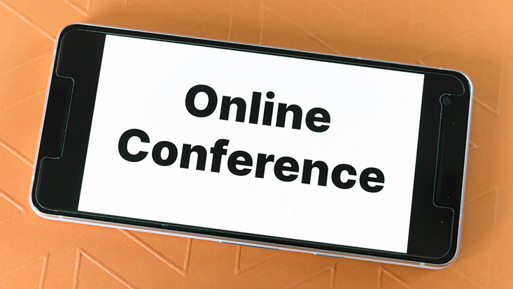 Image with on orange structured background and smartphone showing the words "online conference"