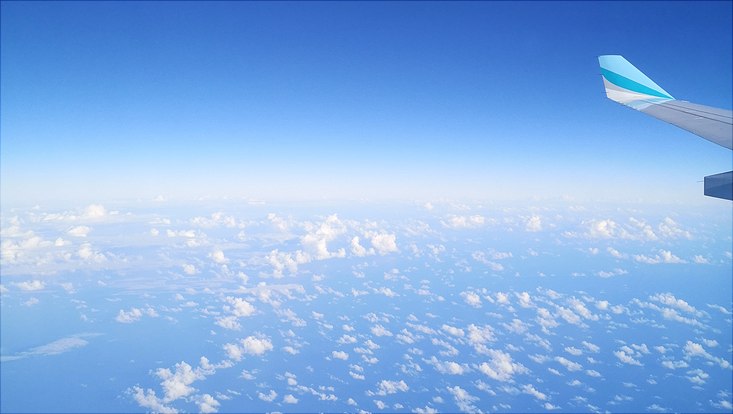 View from aircraft, blue sky with light clouds