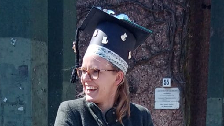 Dorothea Bunzel successfully defended her doctoral thesis. The picture shows Dorothea with her doctoral hat.