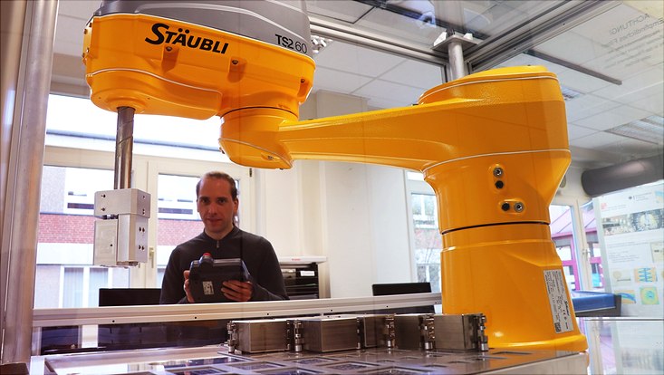 Yellow robot arm in the lab