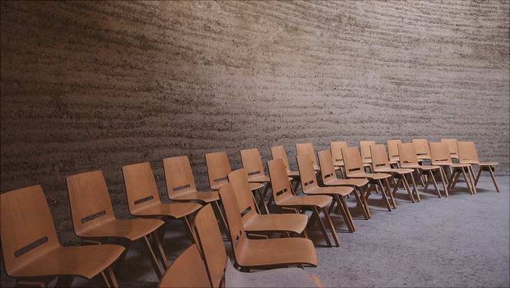 empty chairs in rotund auditorium