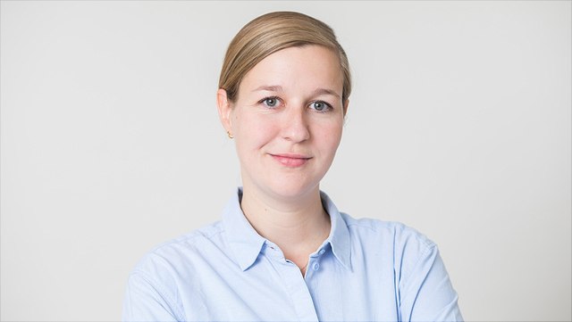 A woman in a blue blouse