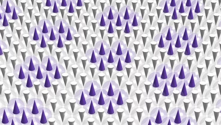 Die Illustration zeigt die Ausrichtung von atomaren "Stabmagneten" eines Eisenfilms in einem magnetischen Mosaikgitter.
