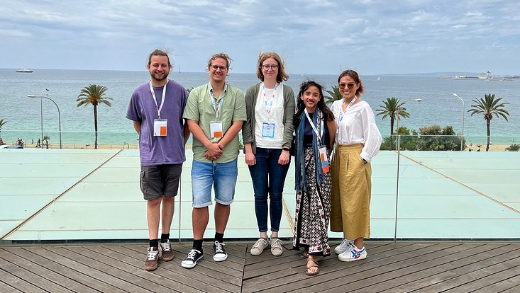 Group photo of the Doctoral Researchers of RTG2530 at the conference in front of the sea.