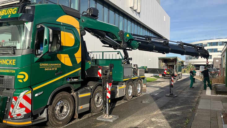 The strongest loading crane in the north lifts a 650kg high pressure helium compressor for MADMAX