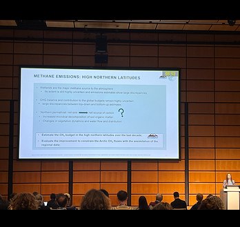 Scientist presenting MOMENT News at a conference