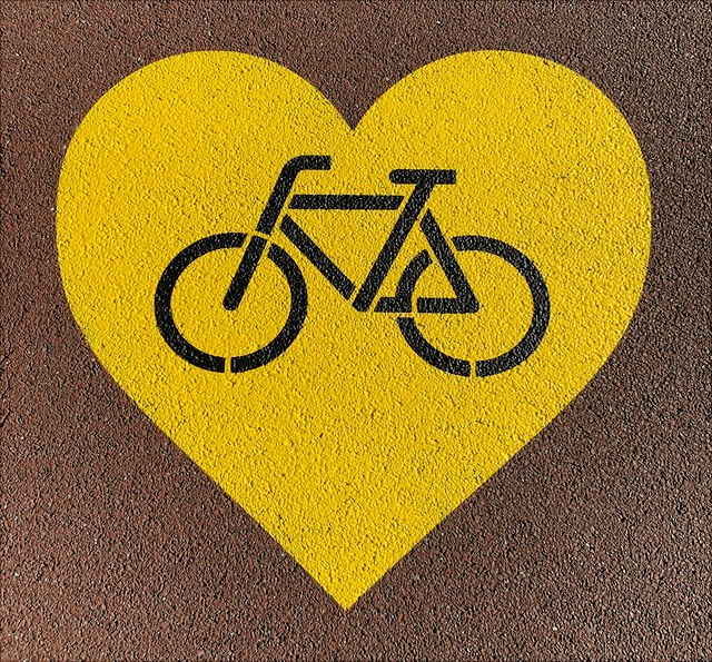 Symbol: Fahrrad in gelbem Herz