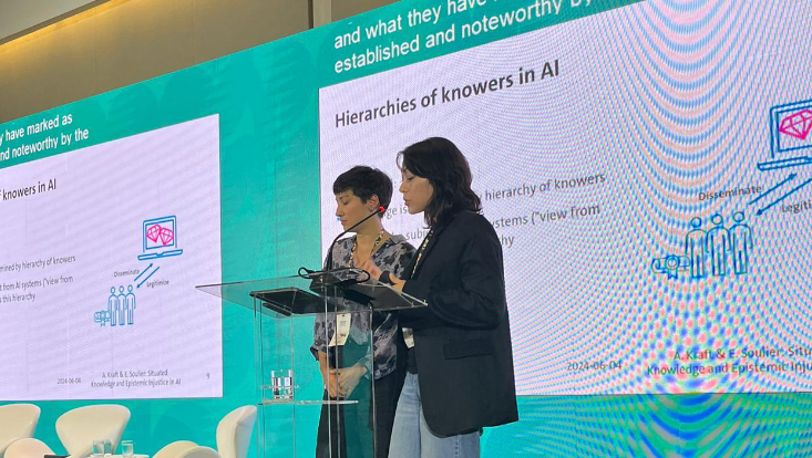 Angelie Kraft and Eloise Soulier presenting their paper on the stage of FAccT 2024