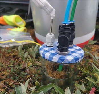 microcosm with soil sample and gas tubes attached