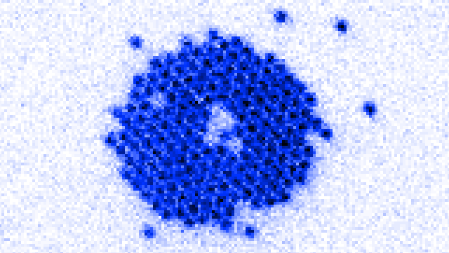 a blue dot with periodic structure