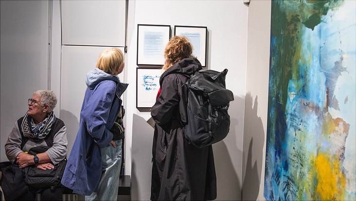 exhibition-24 Visitors discovering the cyanotypes from Dit Coesebrink's artwork