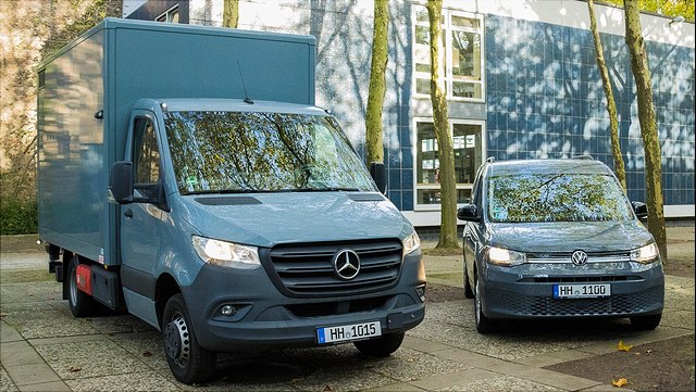 A DB Mercedes Benz and a VW Caddy Maxi in an autumnal ambience on the Chemie campus