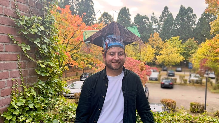 Jesse Theilen wears his doctoral hat.