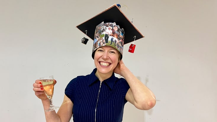 Ella Logemann wears her doctoral cap with a beaming smile.