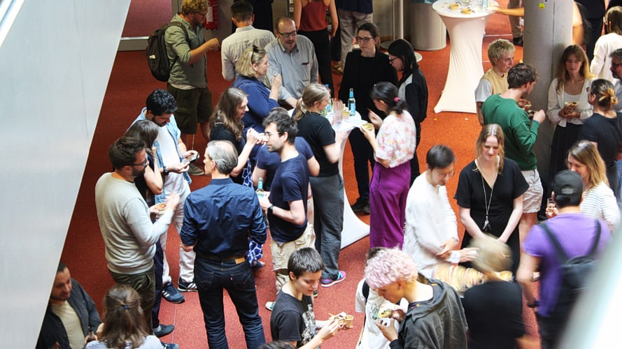 img-9051-889x500 People talking in different circles during a work lunch.