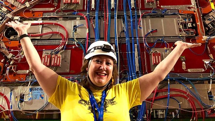 Portrait of Prof Freya Blekman in front of the CMS detector
