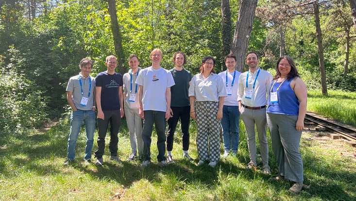 group picture in front of trees