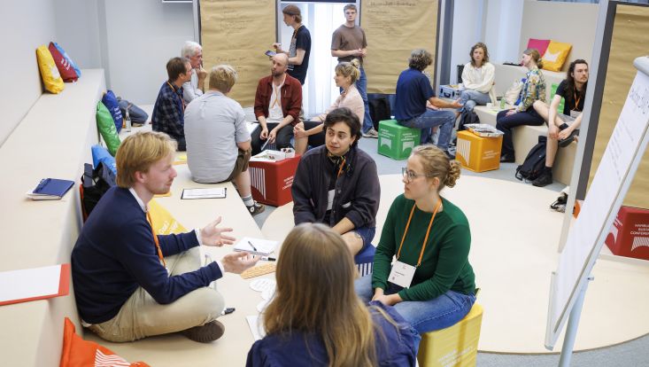 A picture of a room where people are talking