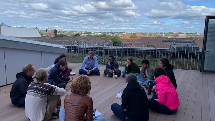 Group sitting in a circle on the floor