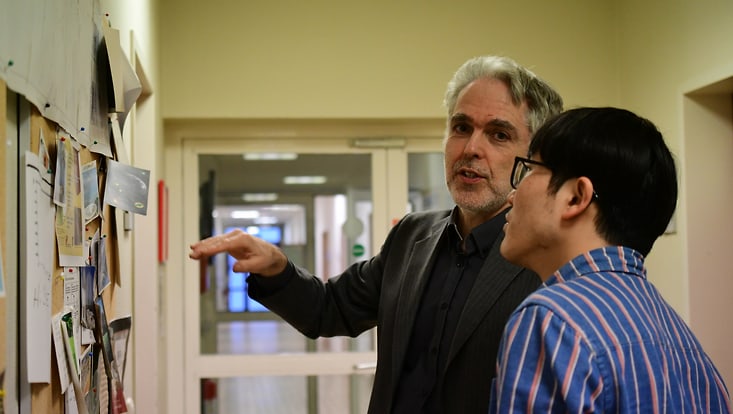 Professor Dieter Horns standing next to his PhD student Quixin Yu