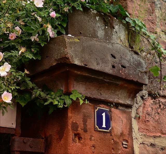 house number on a brick wall