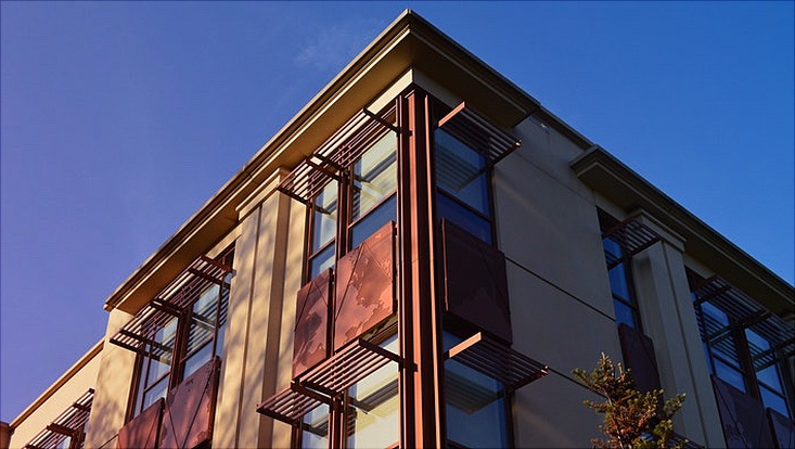 A corner of a building in light of the dawning sun