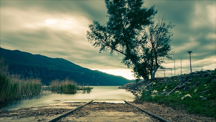 Rails ending in puddle, end time landscape