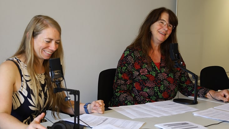 Two women in front of the microphone
