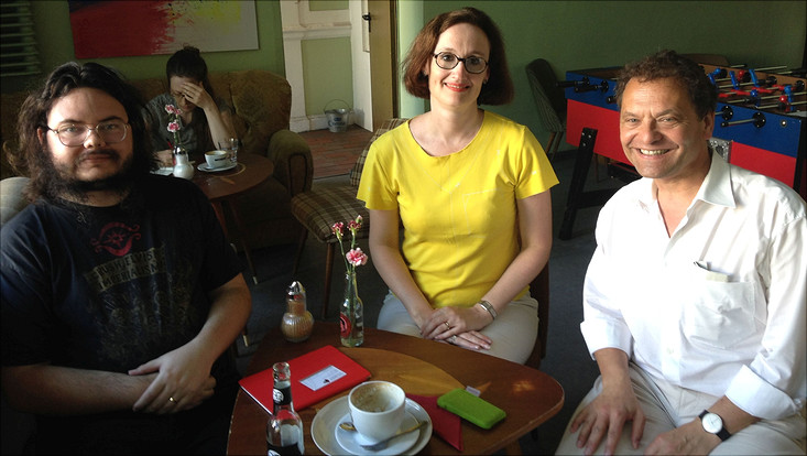 Nugent group foto of two men and one woman in a cafe-bar