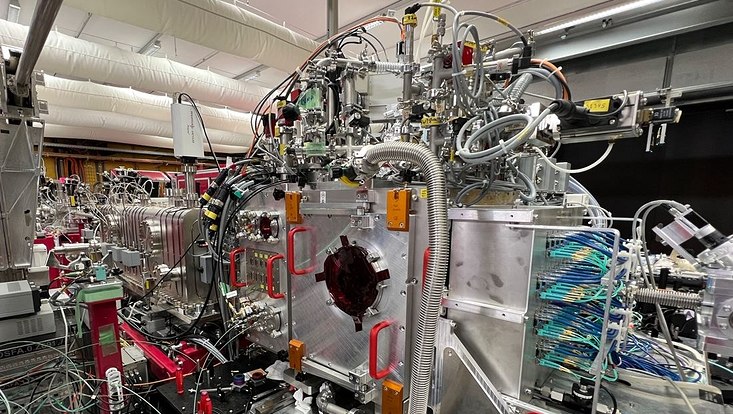 The image shows the construction at X-ray free electron laser at SwissFEL, which generates the ultrashort X-ray pulse required for the analysis of the DNA repair mechanism.
