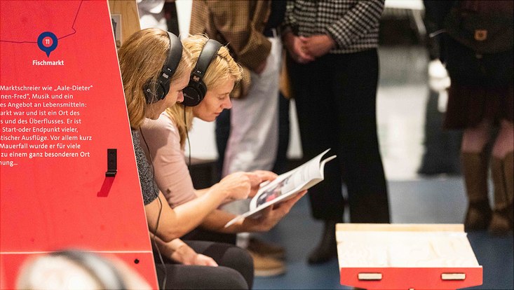 Visitors at the first exhibition with stories about escaping from the GDR to Hamburg