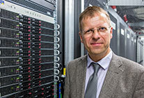 Director of the Regional Computing Center at Universität Hamburg Prof. Dr.-Ing. Stephan Olbrich in front of the new high-performance computer.