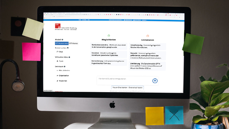 Das Bild zeigt einen iMac-Computer, auf dem im Browser die Startseite des KI-Dienst UHHGPT aufgerufen istl.