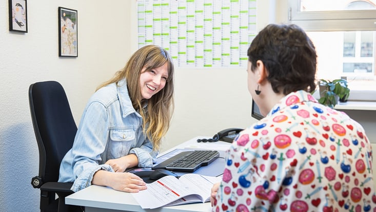 A woman advising a student