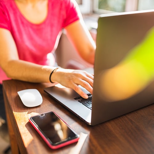 Laptop and Handy on a desk