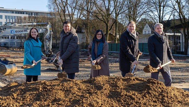Five people with shovels