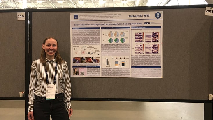 Doctoral researcher presenting her poster at the conference