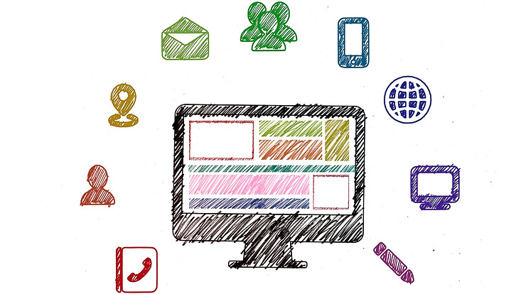 Computer mit Symbolen zum Thema Digitalisierung