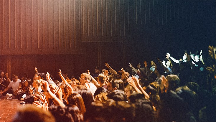 People raising their hands